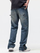 Men’s washed denim wide leg jeans in dark wash with multiple cargo pockets and ankle zipper detailing