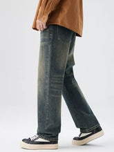 Men’s washed wide leg jeans in dark-wash denim with a relaxed straight-leg cut and subtle fading for a vintage look