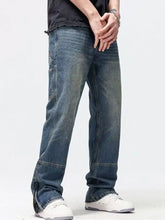 Men’s washed denim wide leg jeans in dark wash with straight-leg cut and zipper fly at the cuffs