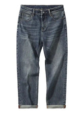 Men’s dark-wash denim wide leg jeans with a straight-leg cut and rolled cuffs for casual wear