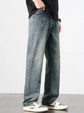 Distressed blue denim men’s washed wide leg jeans with a relaxed straight-leg cut and wide leg design