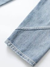Men’s washed wide leg jeans in light-wash denim with a clean straight hem and neatly stitched seams