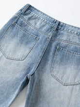 Men’s light-wash denim wide leg jeans with a faded, slightly distressed look and classic back pockets shown from the back