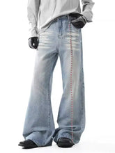 Men’s washed wide leg light-wash denim flare jeans with a vertical chain detail on the outer leg