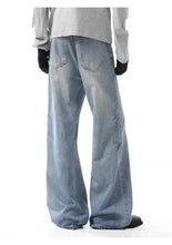 Men’s washed wide leg jeans in light-wash denim with a relaxed fit and wide leg design