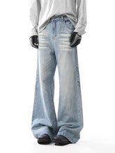 Men’s washed wide leg jeans in light-wash denim with a relaxed fit and subtle fading details
