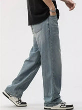 Men’s washed wide leg jeans in light-wash denim with a relaxed straight-leg cut and classic stitching details