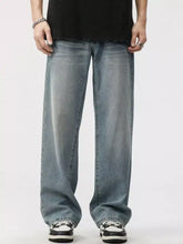 Men’s washed wide leg jeans in light-wash denim with a relaxed straight-leg cut and subtle fading for a casual look