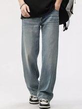 Men’s washed wide leg jeans in light-wash denim with a relaxed straight-leg cut for casual wear