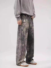 Mens washed wide-leg jeans in mottled gray and black distressed wash made from slightly stretchy denim fabric