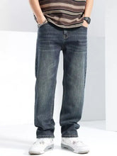 Men’s dark-wash denim wide leg jeans with a relaxed fit and subtle fading showing the front side