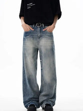 Men’s washed wide leg relaxed fit jeans in faded blue denim with a relaxed fit and frayed cuffs