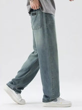 Men’s washed wide leg relaxed fit light-wash denim jeans with a straight-leg cut and visible brand patch on the back pocket
