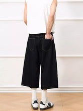 Black denim men’s wide leg capris jeans shown from the back with relaxed wide leg cut and visible back pocket stitching