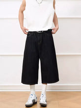 Men’s black wide leg capris jeans in denim with a relaxed fit and visible stitching details