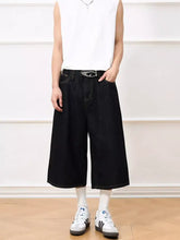 Men’s black wide leg capris jeans in denim with a sleek modern cut and subtle stitching details