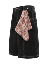 Mens wide-leg black denim shorts with red plaid accent