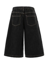 Dark wash wide-leg denim shorts with plaid accent and white stitching