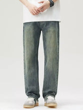Men’s wide leg jeans in dark-wash denim with a relaxed straight-leg cut and subtle fading for a vintage look