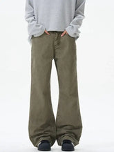 Men’s olive green wide leg denim jeans showcasing a relaxed fit and durable material for casual wear