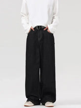 Men’s black wide leg denim jeans with relaxed fit and visible stitching details for casual wear