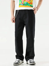 Black men’s wide leg jeans with chain detail at waistband featuring straight-leg design