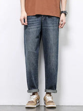 Men’s dark-wash wide leg jeans with relaxed fit and rolled cuffs in durable denim fabric