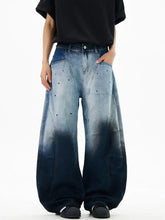 Mens wide leg denim jeans with gradient fade from light blue to dark indigo featuring subtle distressing and reinforced stitching