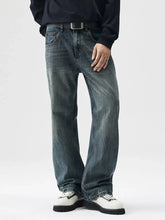 Men’s wide leg dark-wash denim jeans with a relaxed straight-leg cut and subtle fading for a casual modern look