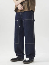 Men’s wide leg jeans in dark blue denim with white stitching and cargo-style pockets