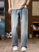 Men’s wide leg jeans in light-wash denim with a relaxed straight-leg cut and subtle fading for a casual modern look