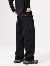Men’s wide-leg jeans in black wide leg cargo style featuring multiple pockets and a relaxed utilitarian design