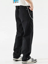 Men’s black denim wide leg jeans with chain detail at waistband and buttoned cuffs for a perfect fit