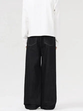 Men’s black wide leg jeans in denim with contrasting stitching and a relaxed straight-cut silhouette
