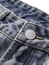 Men’s wide leg blue denim jeans with silver button and visible stitching in durable cotton material