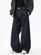 Dark blue wide leg denim jeans with a black belt and silver-tone logo buckle for men