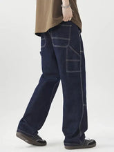 Men’s dark blue denim wide leg jeans with white stitching and multiple pockets for casual wear