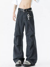 Dark gray wide leg cargo pants for men featuring multiple pockets and decorative belt buckle in sturdy denim material