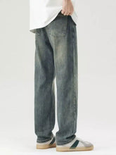 Men’s wide leg jeans in dark-wash denim with a relaxed straight-leg cut and subtle fading for a vintage look