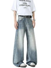 Men’s wide leg jeans in faded blue denim with subtle distressing details for a casual look