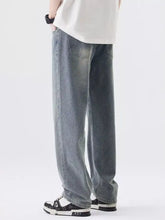 Men’s wide leg jeans in faded gray denim with subtle whiskering and detailed stitching wide leg jeans