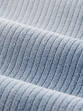 Men’s wide leg jeans in light blue denim fabric with subtle diagonal ribbed texture for casual wear