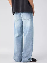 Light-wash denim men’s wide leg jeans shown from the back with a wide leg cut and classic back pockets