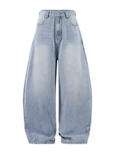 Men’s wide leg jeans in light-wash denim with high-rise ribbed texture and wide leg cut for a modern fit
