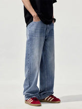 Men’s wide leg jeans in light-wash denim featuring a relaxed, wide-leg cut for casual comfort