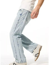 Men’s light-wash wide leg jeans in denim with a relaxed straight-leg cut and visible stitching details