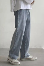 Light-wash denim men’s wide leg jeans with a relaxed, straight-leg cut for comfortable casual wear