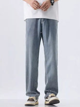 Men’s wide leg jeans in light-wash denim with a relaxed straight-leg cut and classic stitching details