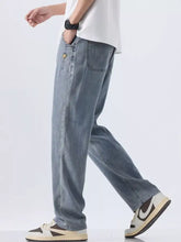 Men’s wide leg jeans in light-wash denim with a relaxed straight-leg cut and subtle stitching details visible from the back