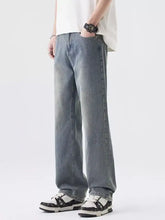 Men’s light-wash denim wide leg jeans with a relaxed straight-leg cut in a casual style